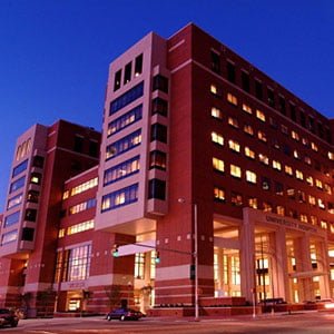 A tall, modern brick building ,the University of Alabama's School of Medicine. End ID.