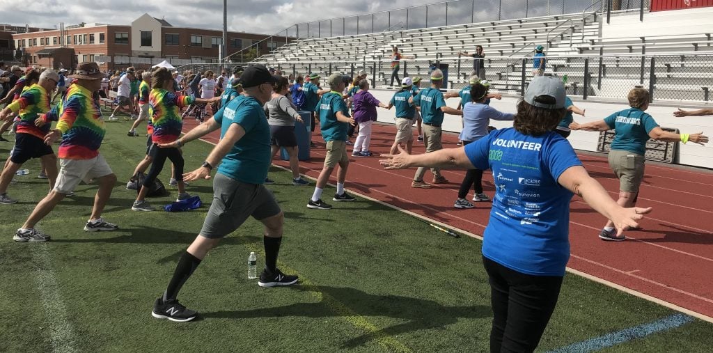 Participants stretch before an event