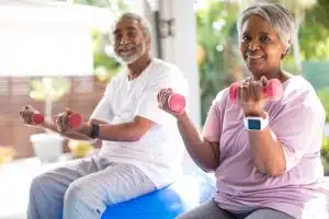 Couple exercising with dumbbells