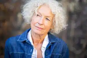 Close up portrait elderly woman glancing outdoors