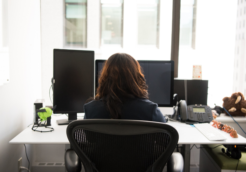 Workplace Giving - Image of woman at desk